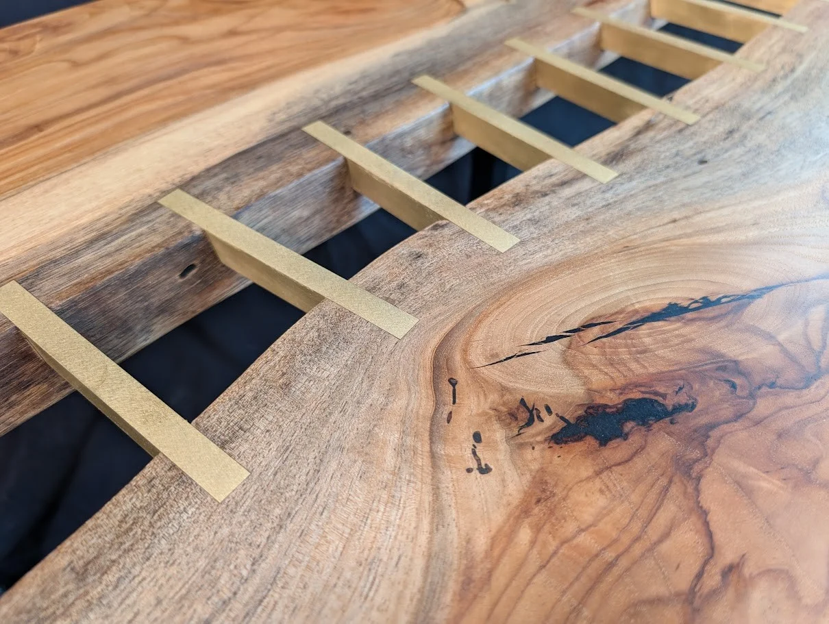 Pecan brass stitched river table — Bad Grackle Woodstudio