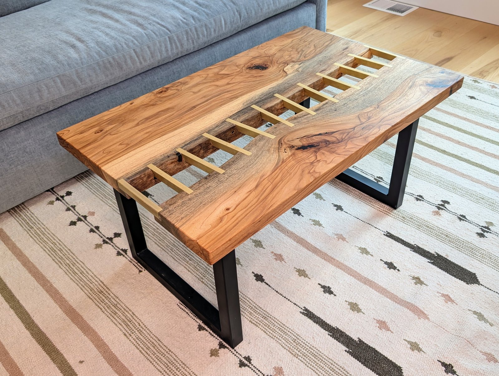 Pecan brass stitched river table