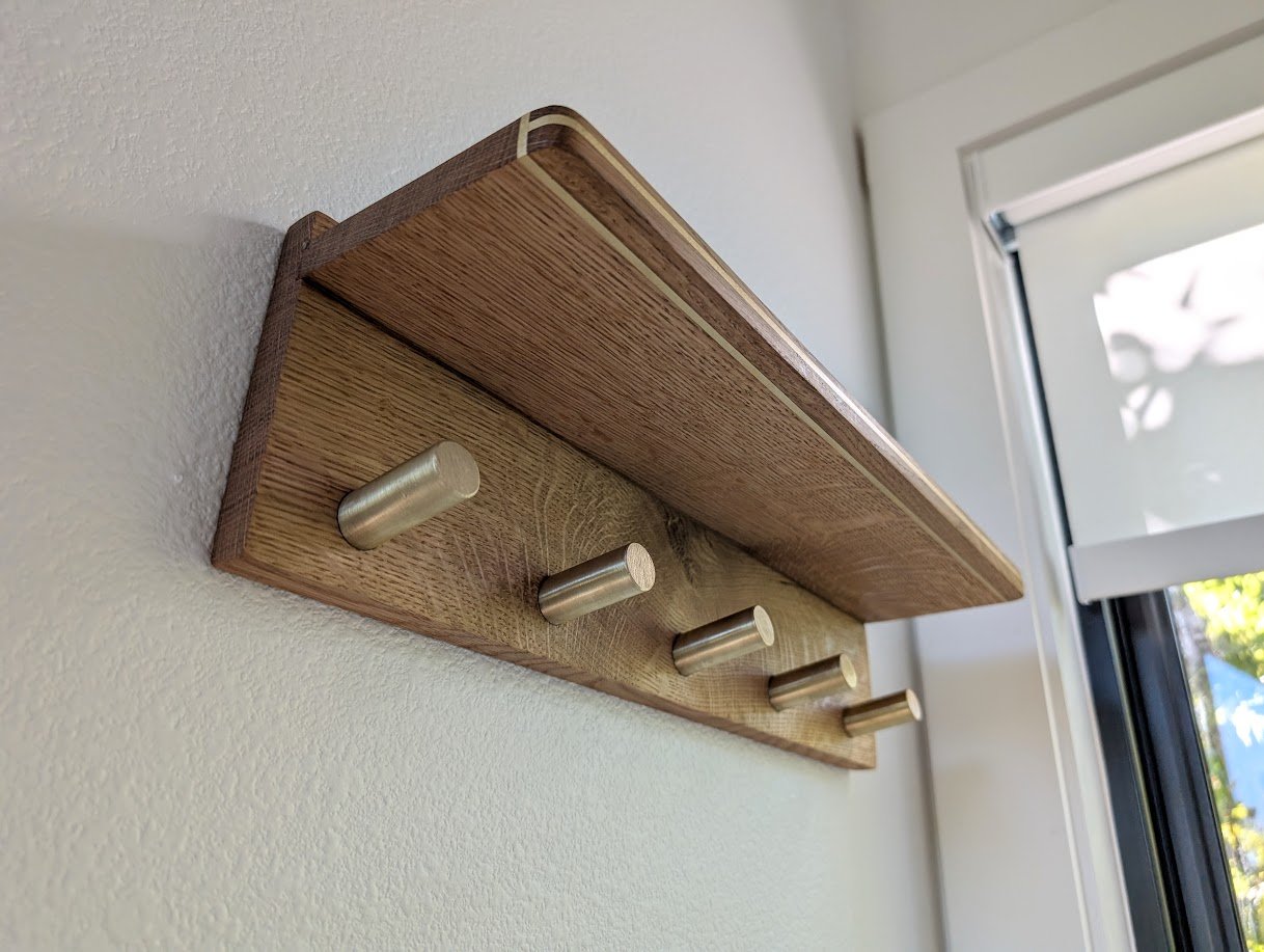 White oak coat rack with brass inlay